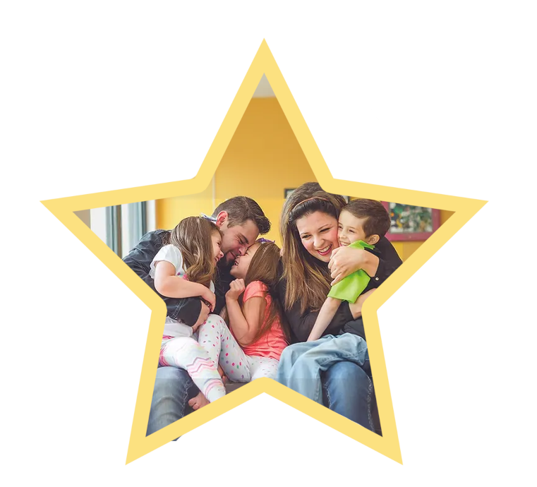 Smiling family inside a yellow star frame